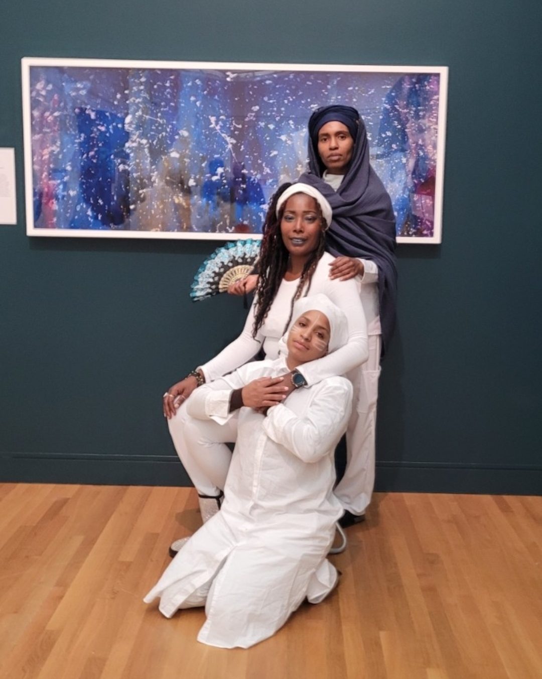 Three Sister Tour members together in a gallery portrait